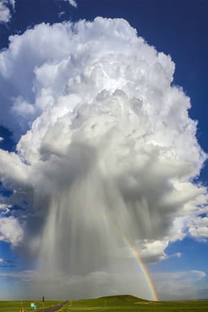 cloudburst with rainbow