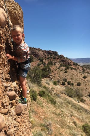 little boy rock climbing
